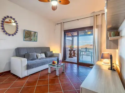 Area soggiorno di Apartment CSC - 5 - Baia de Bahas by Interhome