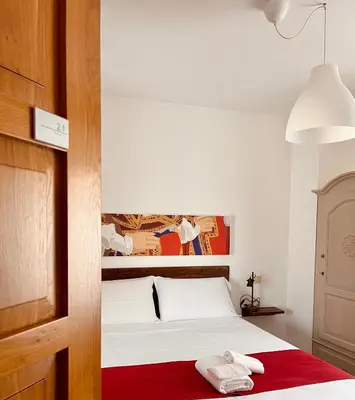 Letto o letti in una camera di Carrales Guest House