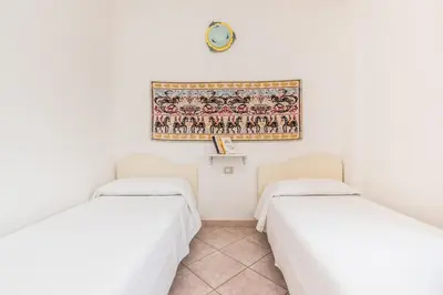 Letto o letti in una camera di Casa Marta