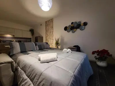 Letto o letti in una camera di La Gardenia Deluxe Apartment
