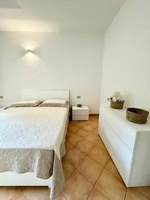 Letto o letti in una camera di Le case in collina - San Teodoro