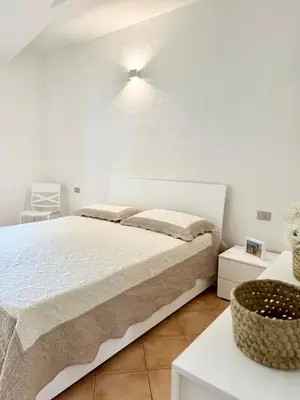 Letto o letti in una camera di Le case in collina - San Teodoro