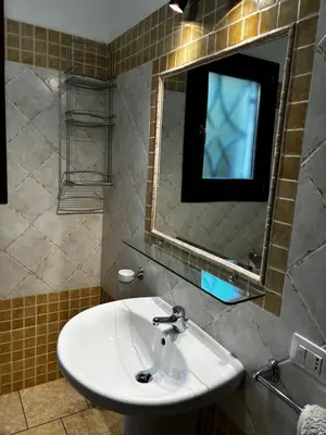 Bagno di Appartamento vista Mare Tanaunella