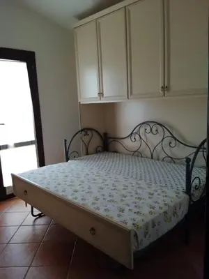 Letto o letti in una camera di B1 Lu Maestrali 1Piano