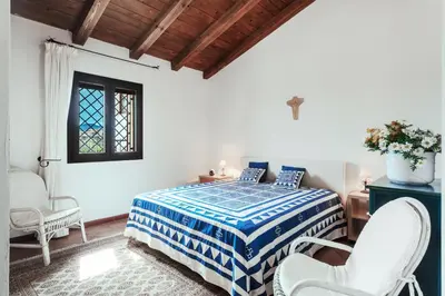 Letto o letti in una camera di Villa caposchiera a 150m dal mare