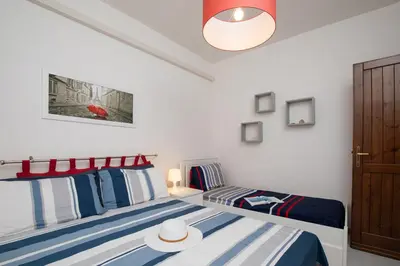 Letto o letti in una camera di Casa Marisa by Wonderful Italy