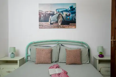Letto o letti in una camera di Casa Marisa by Wonderful Italy
