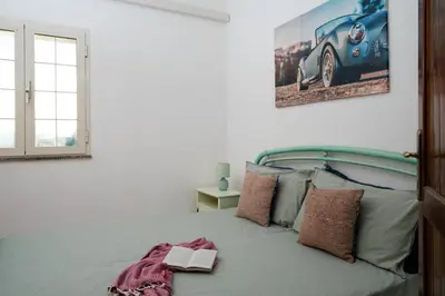 Letto o letti in una camera di Casa Marisa by Wonderful Italy