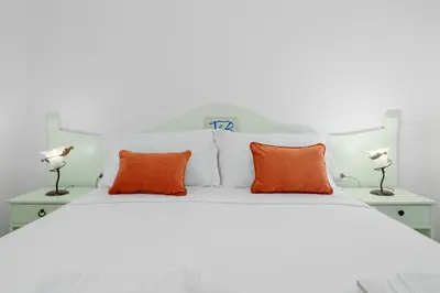 Letto o letti in una camera di Tenuta Lu Baroni