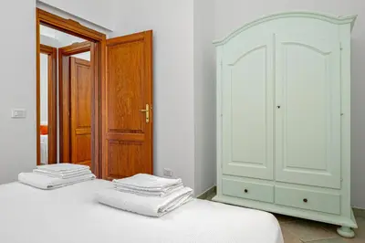 Letto o letti in una camera di Tenuta Lu Baroni