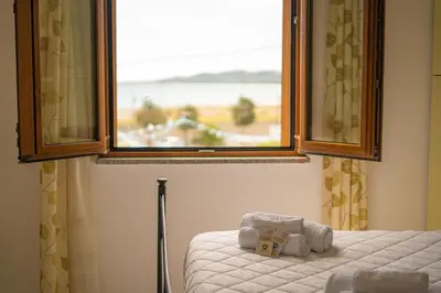 Letto o letti in una camera di La Caletta 2