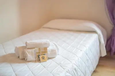 Letto o letti in una camera di Capo Comino 1