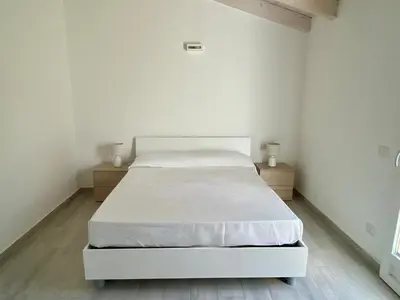 Letto o letti in una camera di Villetta 2 La Caletta