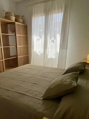 Letto o letti in una camera di Appartamento Pelasgi - Murta Maria