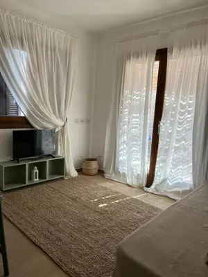 TV o dispositivi per l'intrattenimento presso Appartamento Pelasgi - Murta Maria