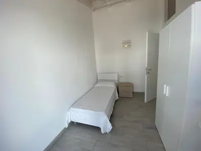 Letto o letti in una camera di Villetta 3 La Caletta
