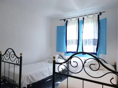 Letto o letti in una camera di Casa Li Salineddi