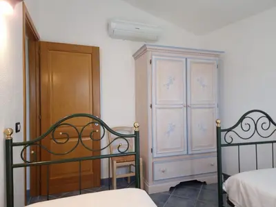 Letto o letti in una camera di Casa Li Salineddi
