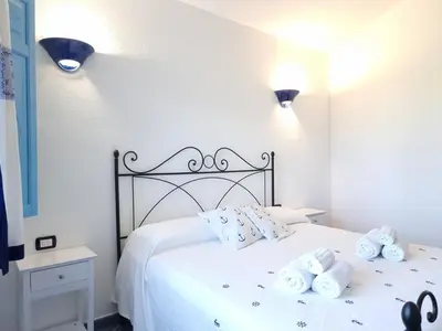 Letto o letti in una camera di Casa Li Salineddi