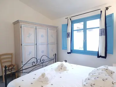 Letto o letti in una camera di Casa Li Salineddi