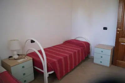 Letto o letti in una camera di Villette lu nibaru by BudoniAffitti