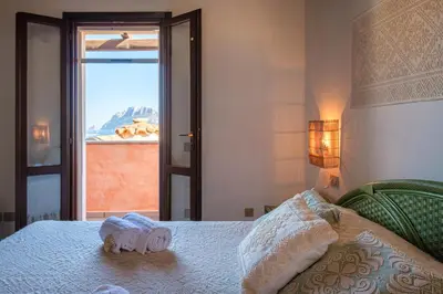 Letto o letti in una camera di Vista Mare-Isola Tavolara e Solarium Panoramico