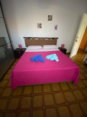 Letto o letti in una camera di A casa da Mari stanza privata Bagno condiviso