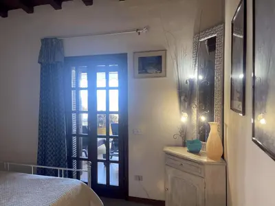 Letto o letti in una camera di PUNTA EST QUADRILOCALE TERRAZZA FAVOLOSA VISTA MARE