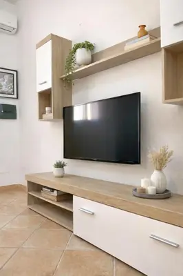 TV o dispositivi per l'intrattenimento presso Square Inn Apartment