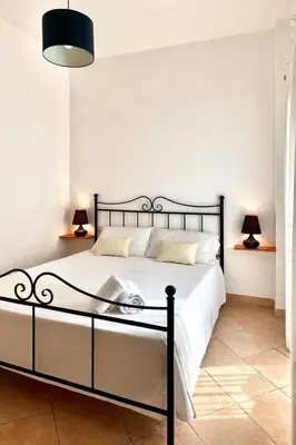 Letto o letti in una camera di Square Inn Apartment