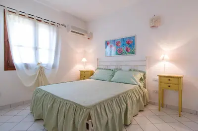 Letto o letti in una camera di Appartamento Rododendro con A/C