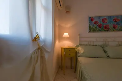 Letto o letti in una camera di Appartamento Rododendro con A/C