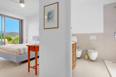Letto o letti in una camera di Villa Mirtillo Golfo Aranci