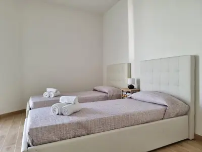 Letto o letti in una camera di Villa Lu Tizzoni