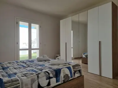Letto o letti in una camera di Villa Lu Tizzoni