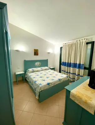 Letto o letti in una camera di Villetta a Tanaunella