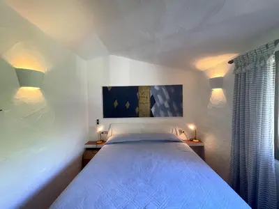 Letto o letti in una camera di VILLA FARFALLE CON STREPITOSA SCOGLIERA PRIVATA