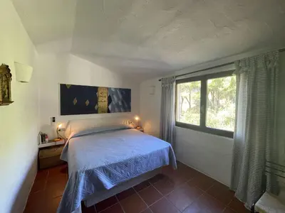 Letto o letti in una camera di VILLA FARFALLE CON STREPITOSA SCOGLIERA PRIVATA