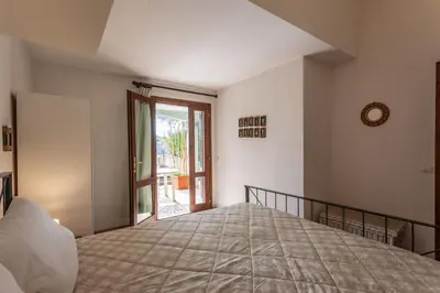 Letto o letti in una camera di Sa Domo e Aurelia