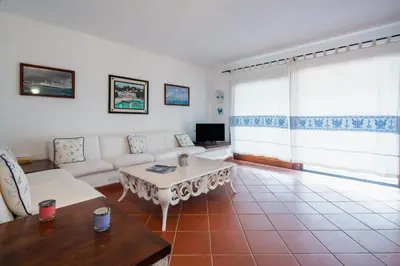 TV o dispositivi per l'intrattenimento presso Appartamento Baia Caddinas fronte mare