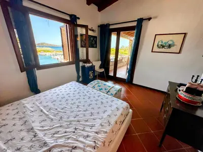 Letto o letti in una camera di Pearl Home - Sea View and 10 min from La Cinta and Lu Impostu Beach