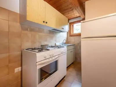 Cucina o angolo cottura di Pittulongu Villa near Rocce Beach for 4