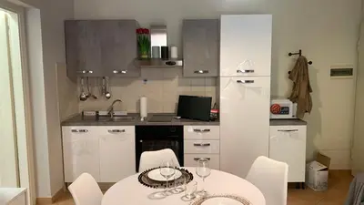 Cucina o angolo cottura di NEST HOUSE - ESCLUSIVO APPARTAMENTO Marina di Olbia- MATER OLBIA - Beaches - close to the Airport - PRIVATE PARKING- Full comforts -