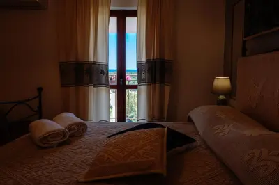Letto o letti in una camera di affittacamere IL CASTELLO posada