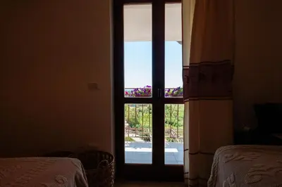 Letto o letti in una camera di affittacamere IL CASTELLO posada