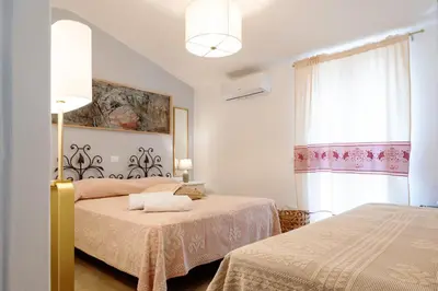 Letto o letti in una camera di affittacamere IL CASTELLO posada