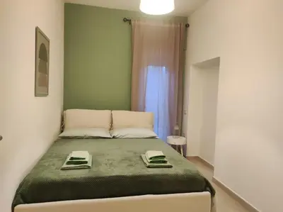 Letto o letti in una camera di Casa Mariangela