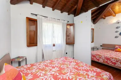 Letto o letti in una camera di Villetta Monica
