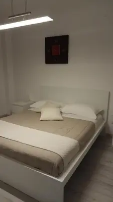 Letto o letti in una camera di VILLA SA MINDA NOA 2 camere 2 bagni ARIA CONDIZIONATA e giardino