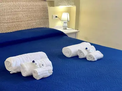 Letto o letti in una camera di Punta Est Trilocale Stupenda Vista Mare